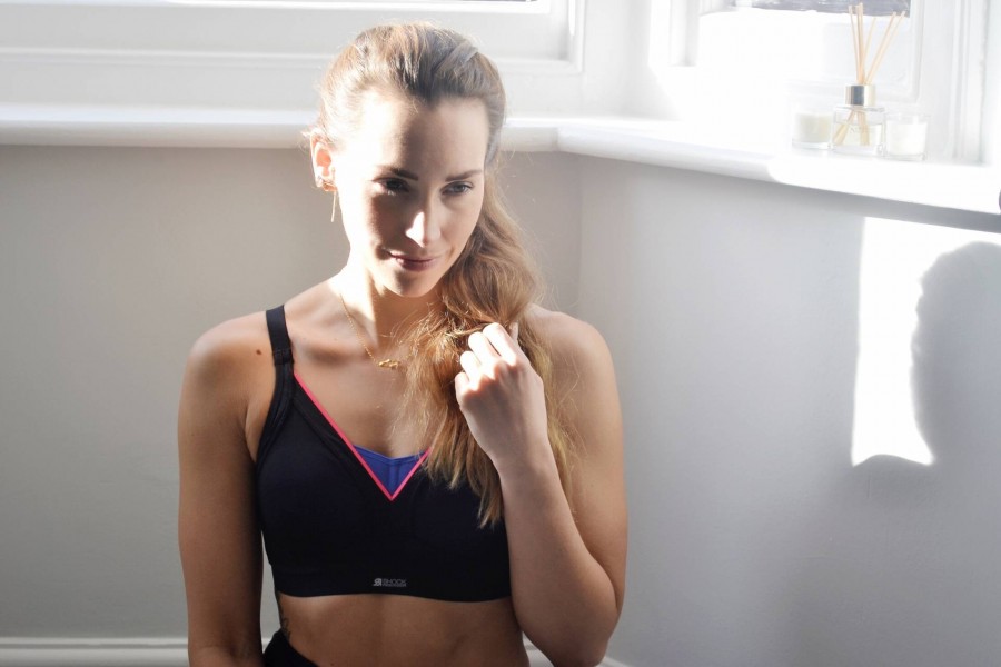 LS Female fair hair tied into chignon, wearing a sports bra top